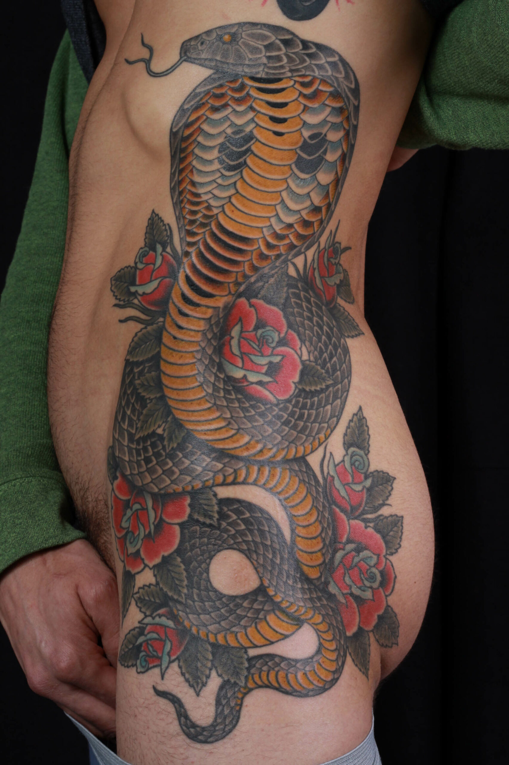 brian-thurow-dedication-tattoo-ribs-hip-cobra-snake-roses