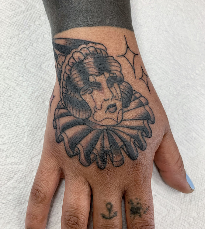 Black and Grey Clown Girl on Hand by Alec Rowe
