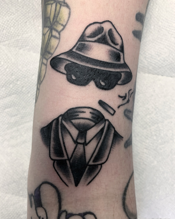 Black and Grey Traditional Invisible Man Tattoo by Alec Rowe