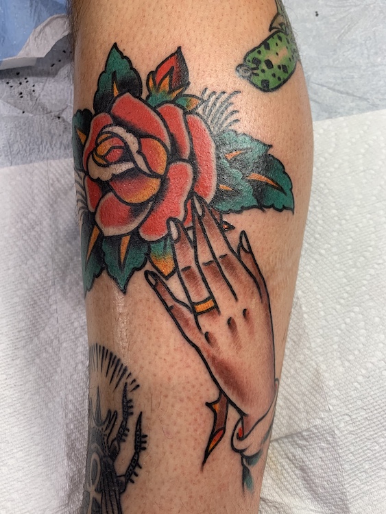 Hand Holding Rose Tattoo