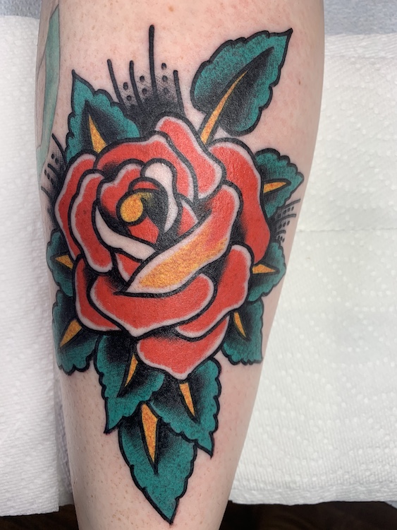 traditional rose sleeve tattoo