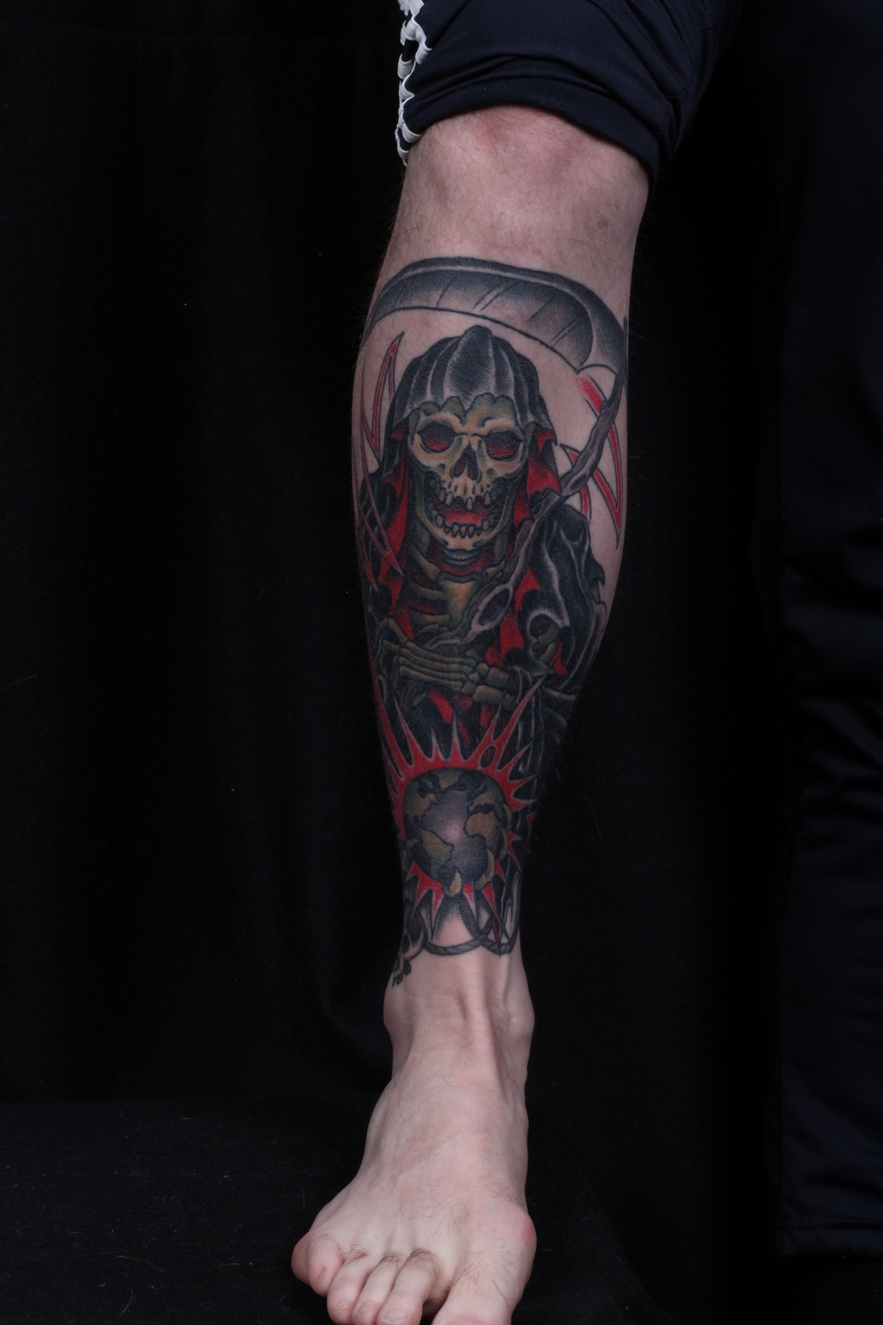 Reaper tattooed in the American Traditional style. Made at Denver's finest Dedication Tattoo.