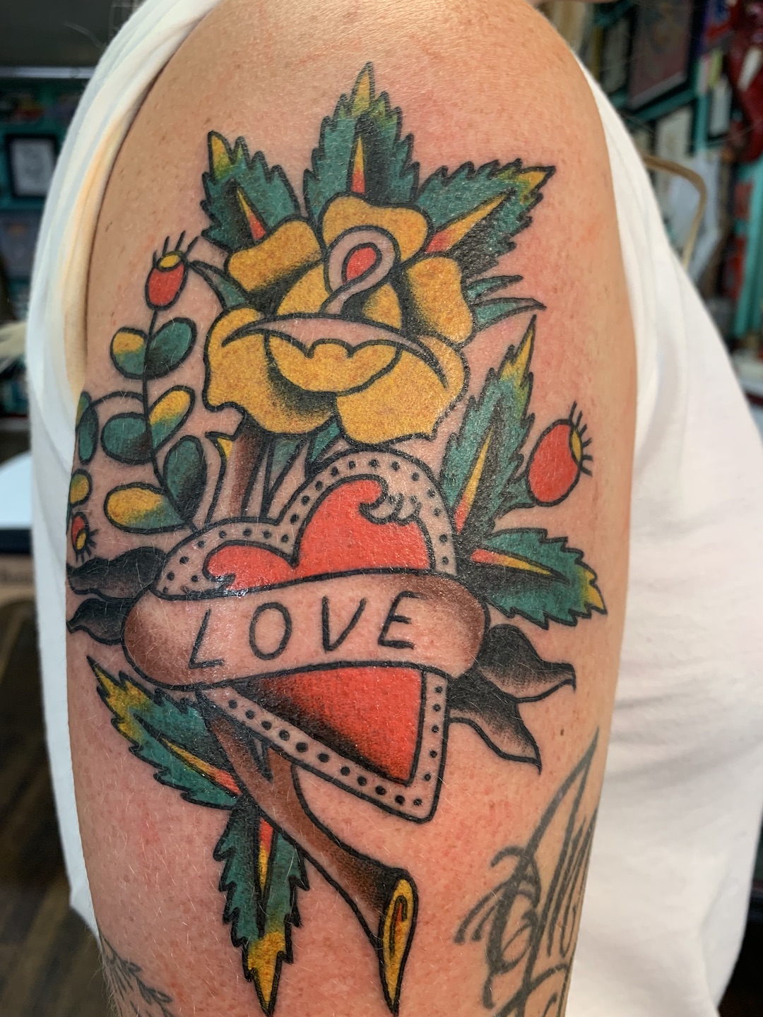 Rose Heart tattooed in the American Traditional style. Made at Denver's finest Dedication Tattoo.