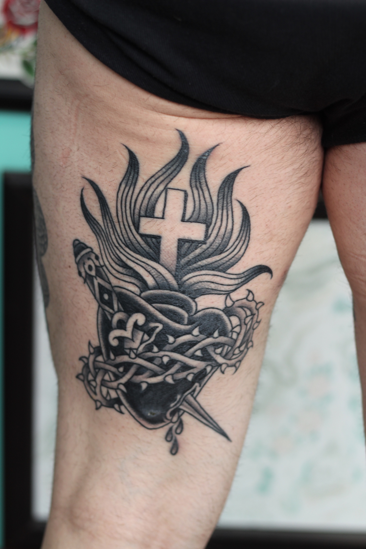Sacred heart w/ Dagger tattooed in the American Traditional style. Made at Denver's finest Dedication Tattoo.