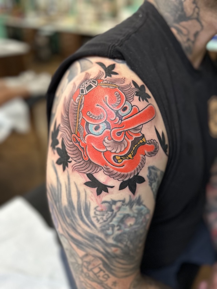 Tengu mask tattooed in the Japanese Traditional style. Made at Denver's finest Dedication Tattoo.