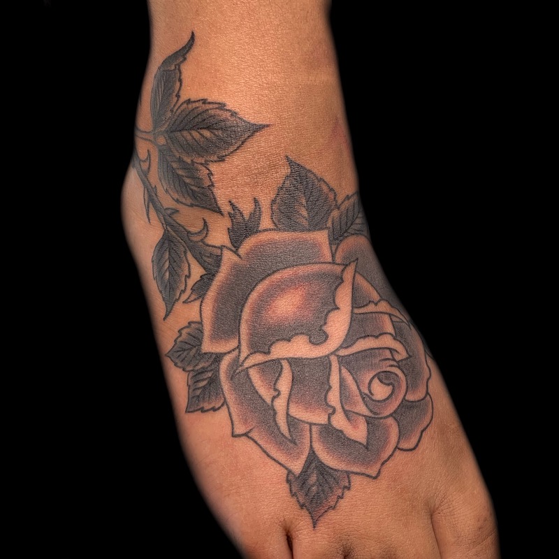 Rose tattooed in the American Traditional style. Made at Denver's finest Dedication Tattoo.