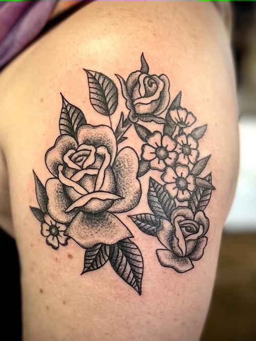 Floral arrangement tattooed in the American Traditional style. Made at Denver's finest Dedication Tattoo.