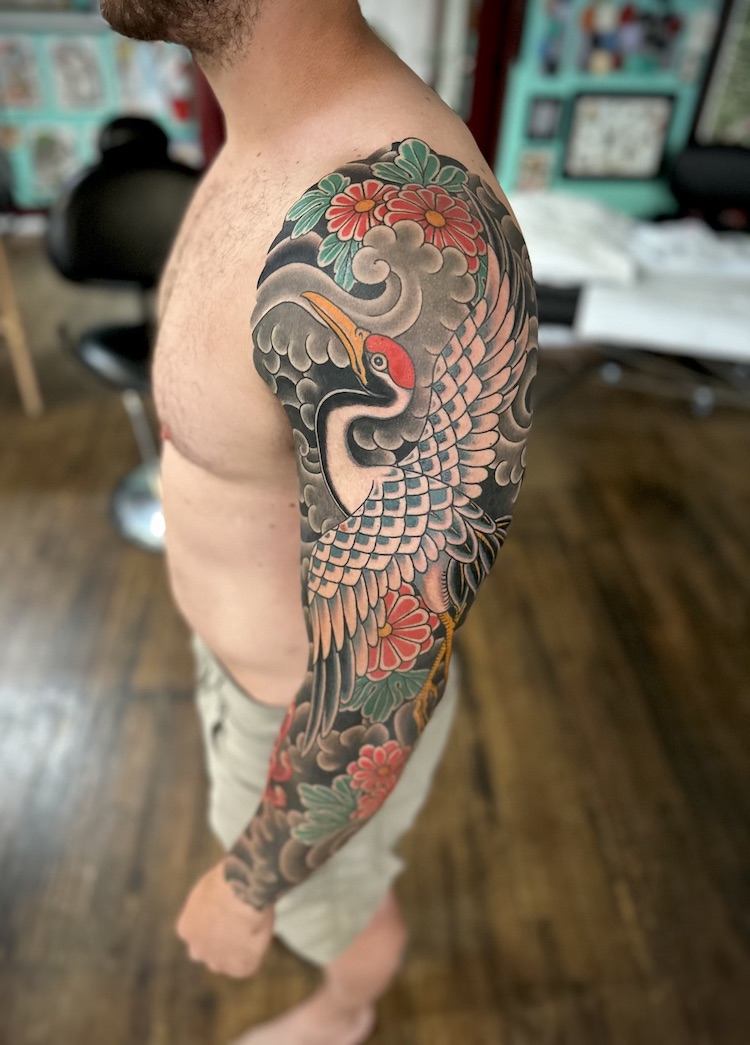 Crane and floral full sleeve tattooed in the Japanese Traditional style. Made at Denver's finest Dedication Tattoo.