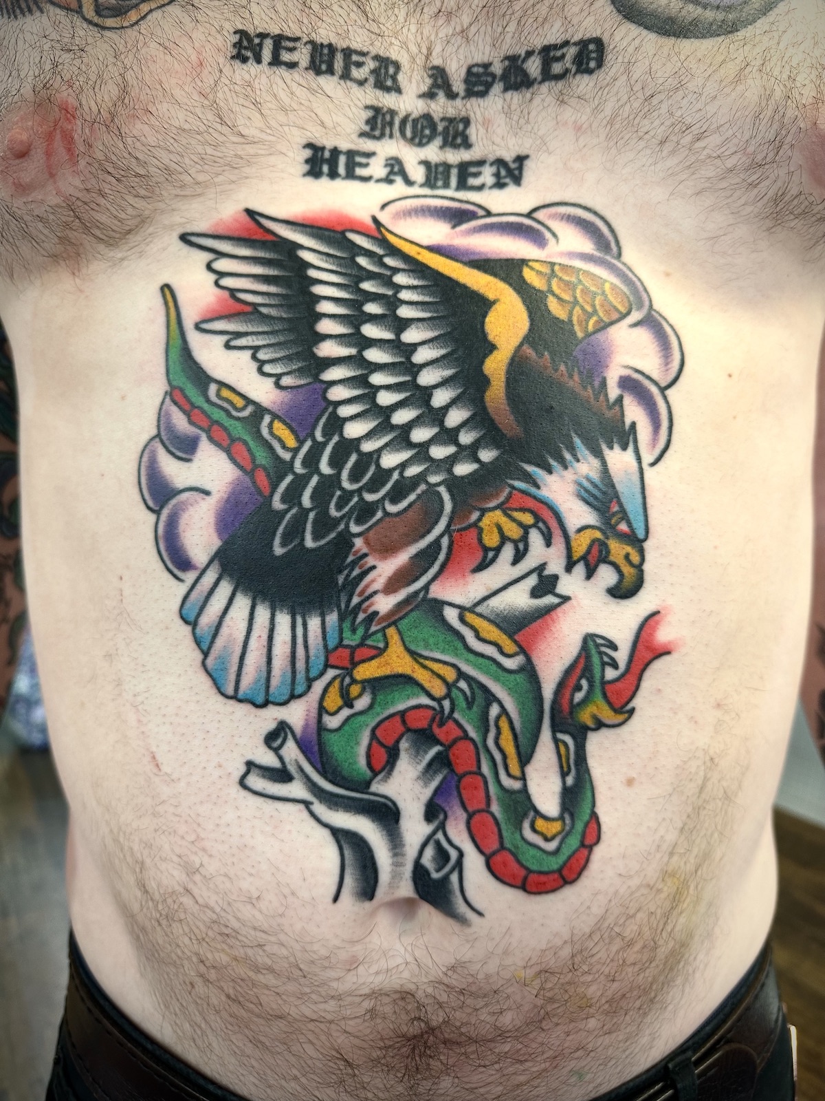 Eagle Snake battle tattooed in the American Traditional style. Made at Denver's finest Dedication Tattoo.