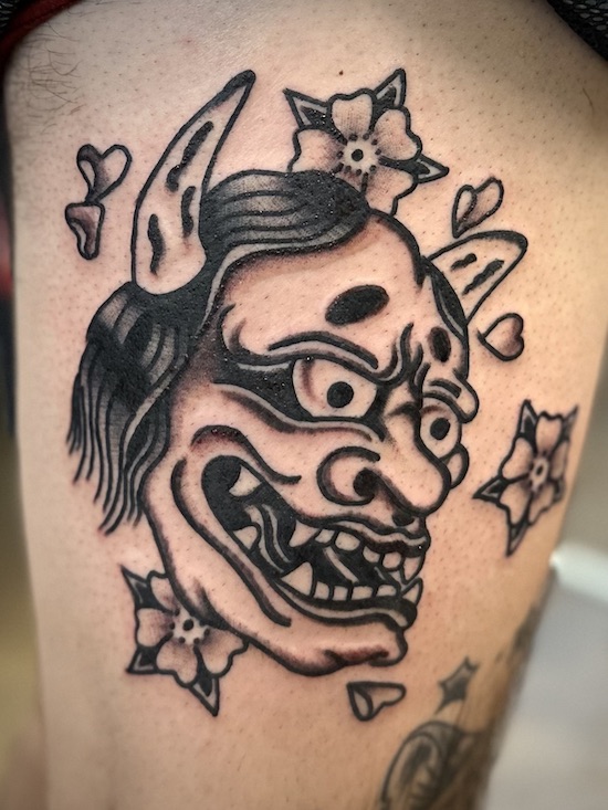 Hannya mask tattooed in the American Traditional style. Made at Denver's finest Dedication Tattoo.