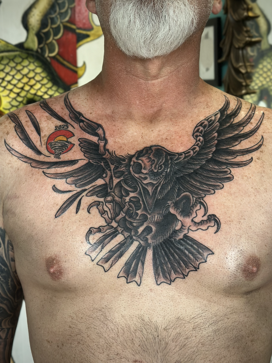 Decomposing Raven on the chest tattooed in the American Traditional style. Made at Denver's finest Dedication Tattoo.